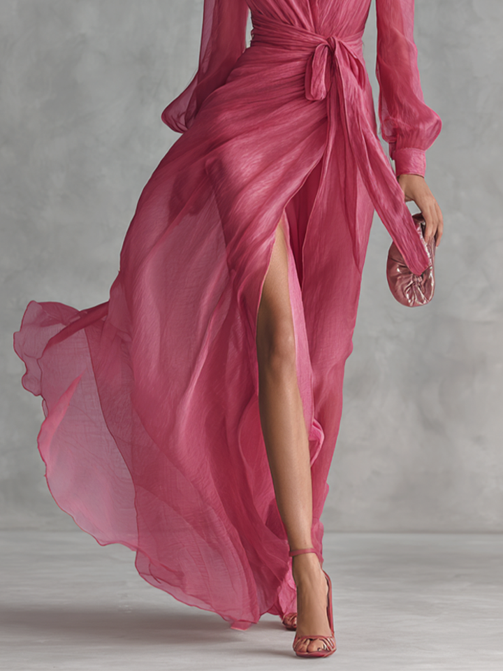 Elegant long women's dress in pearl pink chiffon with V-neck and waist belt
